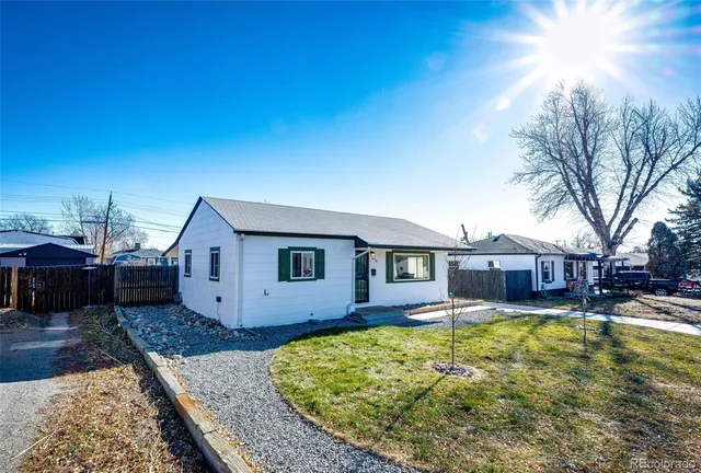a swimming pool view with a seating space and a garden view