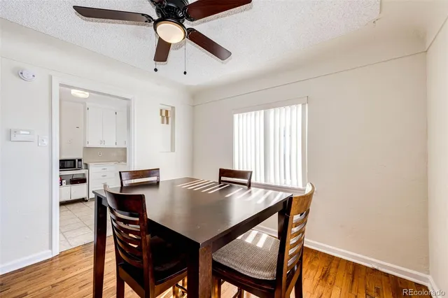a view of a dining room with furniture and window