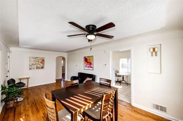 a living room with furniture a rug and a window