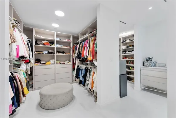 a spacious bathroom with a double vanity sink mirror and double