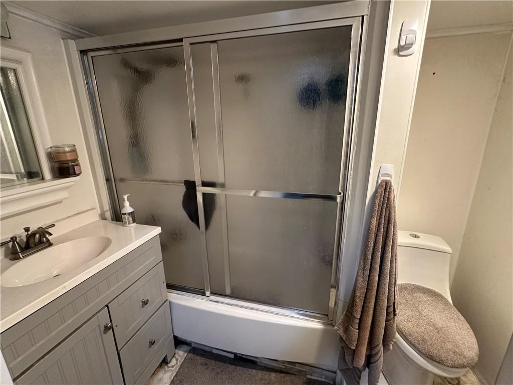 6775 Low Street Mount Pleasant, PA 15666 - Photo 8 of 23 a bathroom with a sink toilet and shower