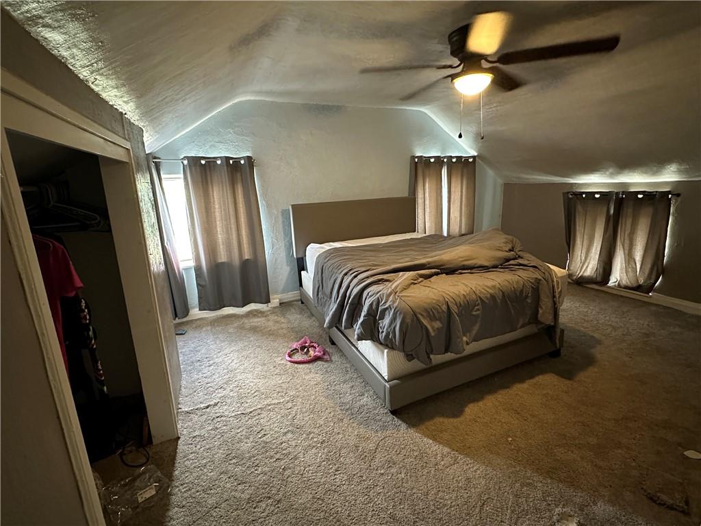 6775 Low Street Mount Pleasant, PA 15666 - Photo 10 of 23 a bedroom with a bed and a chandelier