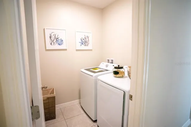 a utility room with dryer and washer