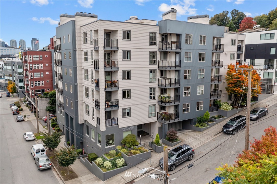 769 Hayes Street, Unit 609 Seattle, WA 98109 - Photo 1 of 26 a city view with tall buildings and cars parked in front of it