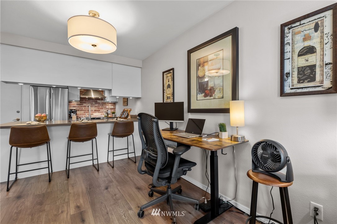 769 Hayes Street, Unit 609 Seattle, WA 98109 - Photo 6 of 26 a workspace with wooden floor and a workspace