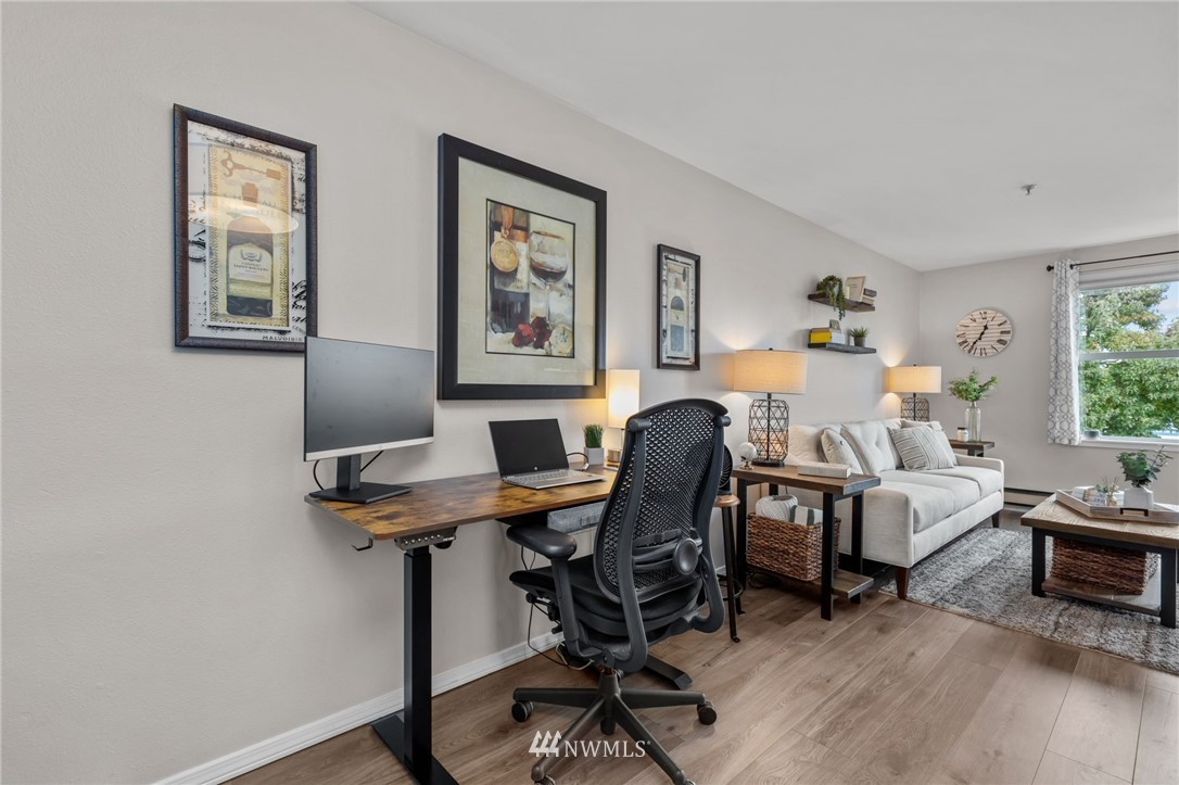 769 Hayes Street, Unit 609 Seattle, WA 98109 - Photo 7 of 26 a view of a workspace with furniture and a window