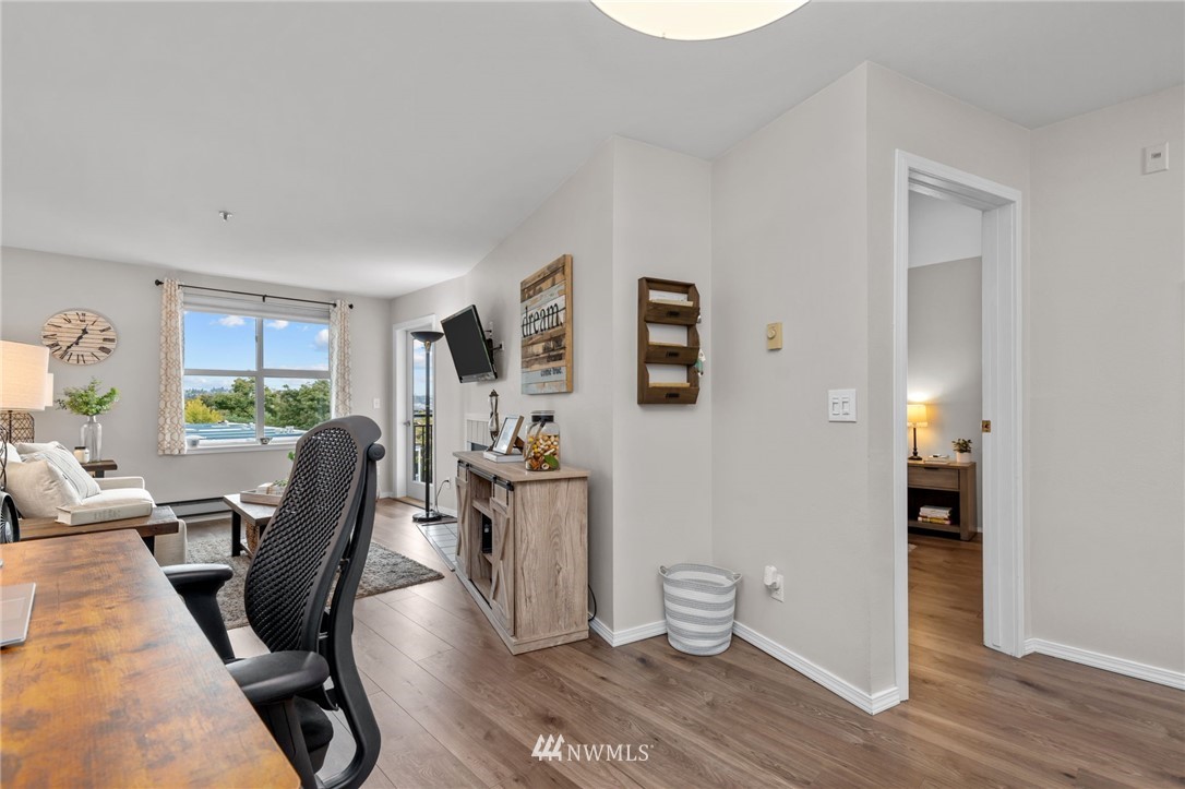 769 Hayes Street, Unit 609 Seattle, WA 98109 - Photo 8 of 26 a view of a livingroom with furniture and a window