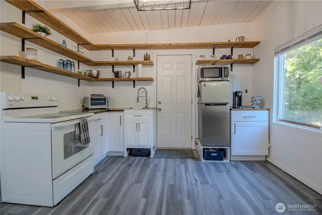a view of a dining room with furniture window and outside view