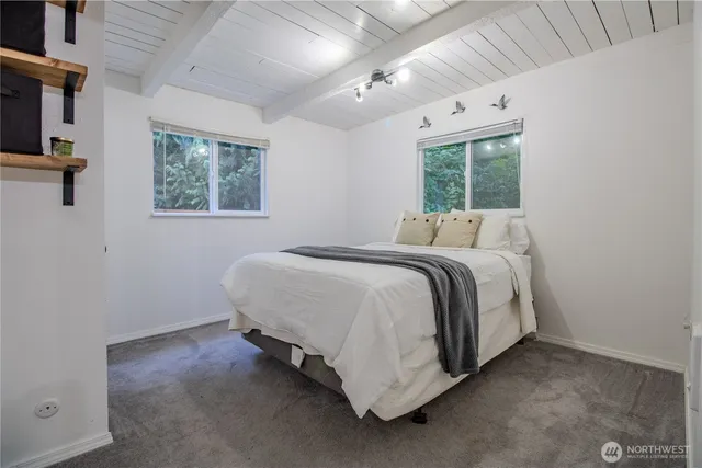 a bedroom with a bed and cabinets