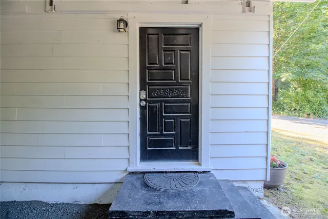 a bed room with a bed and a chair