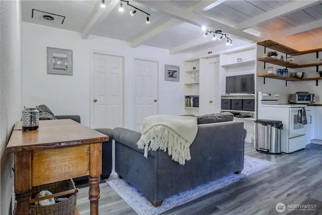 a view of a dining room with furniture and wooden floor