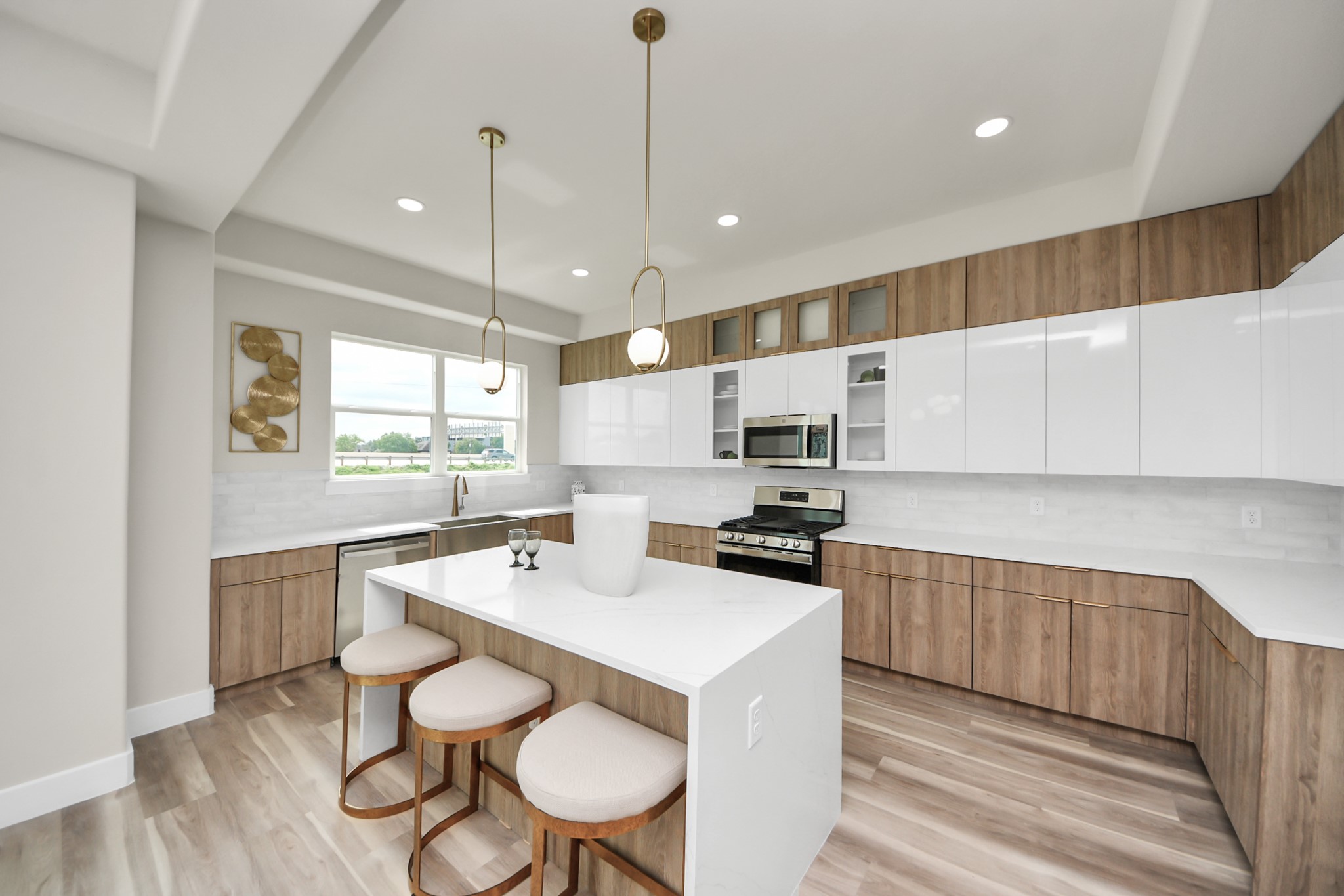 2016 Blodgett Street Houston, TX 77004 - Photo 19 of 49 a kitchen with a sink a stove a refrigerator cabinets and wooden floor