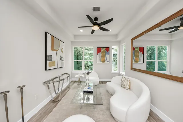 a living room with furniture and a window