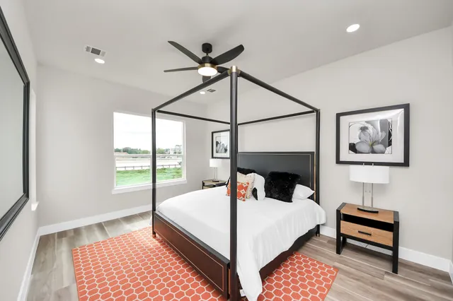 a bed room with a bed and a lamp