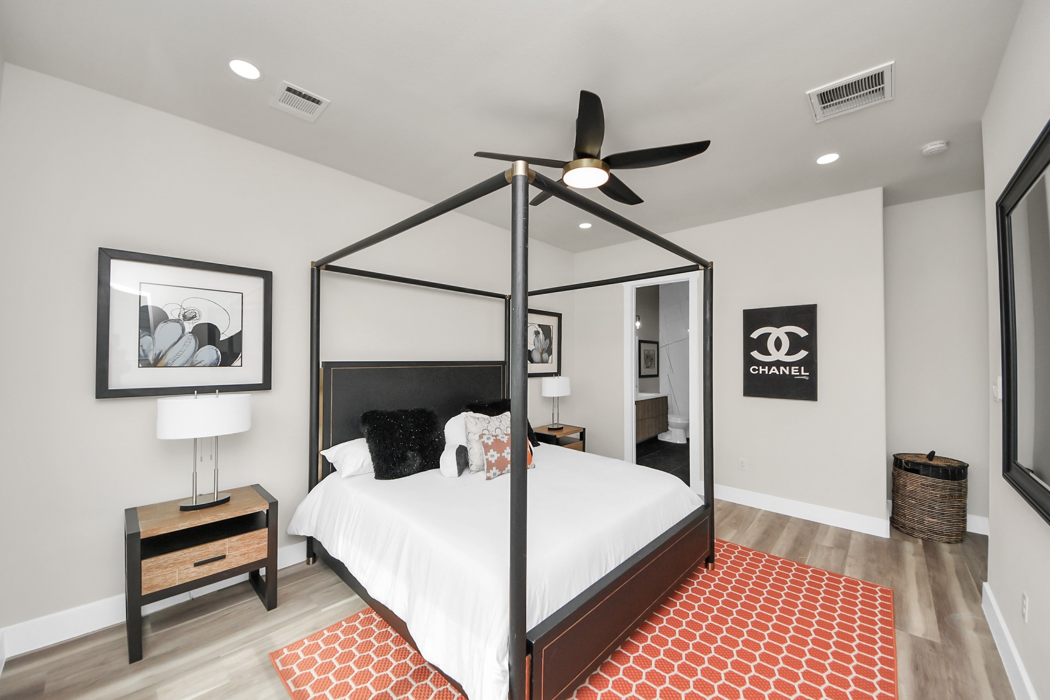 2016 Blodgett Street Houston, TX 77004 - Photo 30 of 49 a bedroom with a bed and a lamp