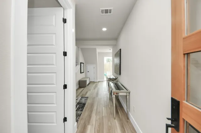 a view of a living room with a wooden floor
