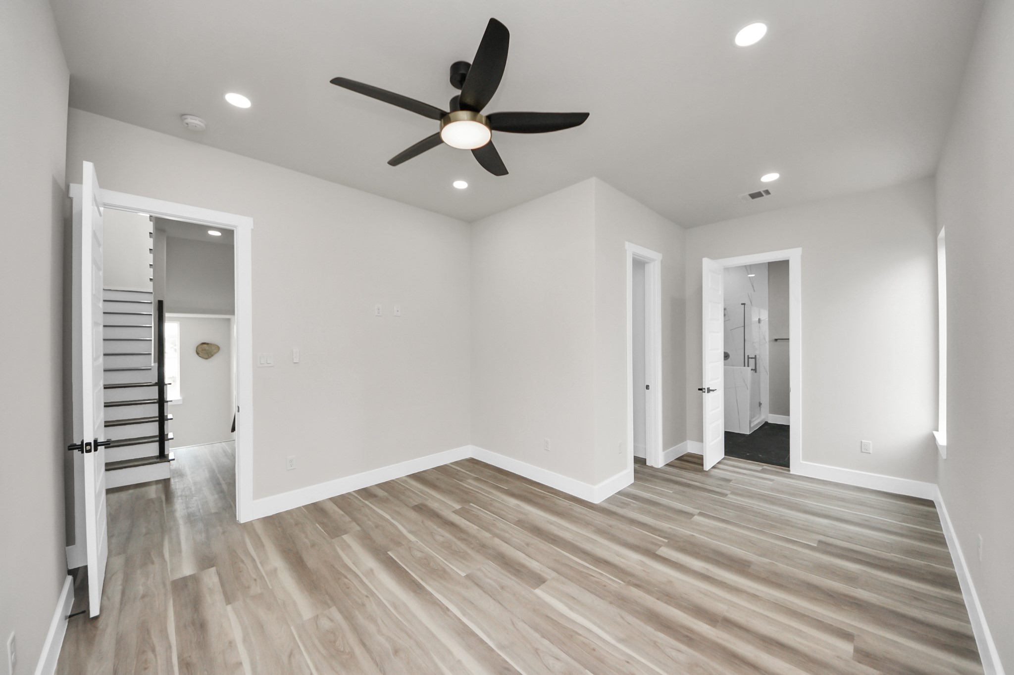 2016 Blodgett Street Houston, TX 77004 - Photo 36 of 49 a view of a room with wooden floor and ceiling fan