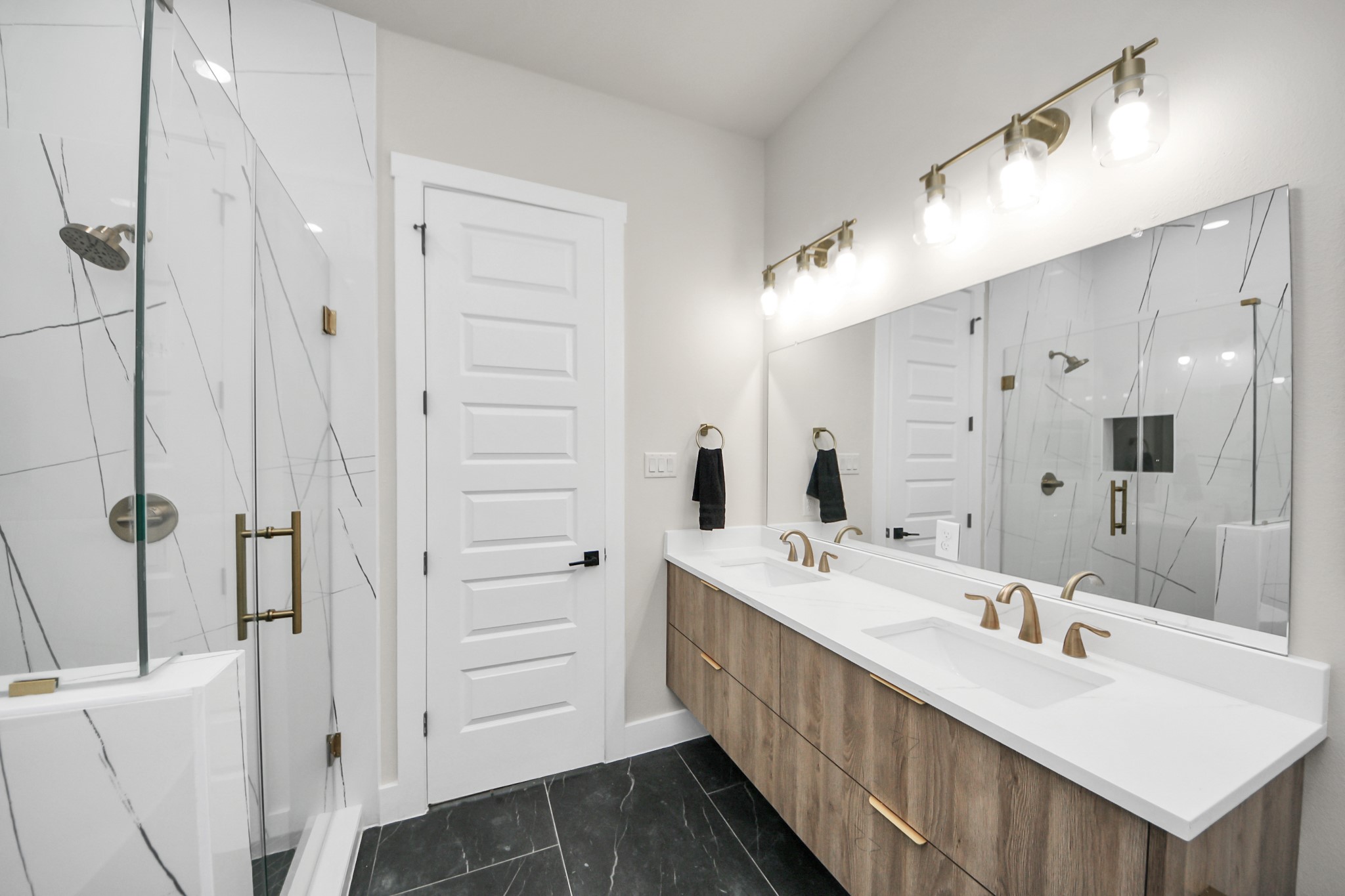 2016 Blodgett Street Houston, TX 77004 - Photo 38 of 49 a bathroom with a double vanity sink mirror and shower