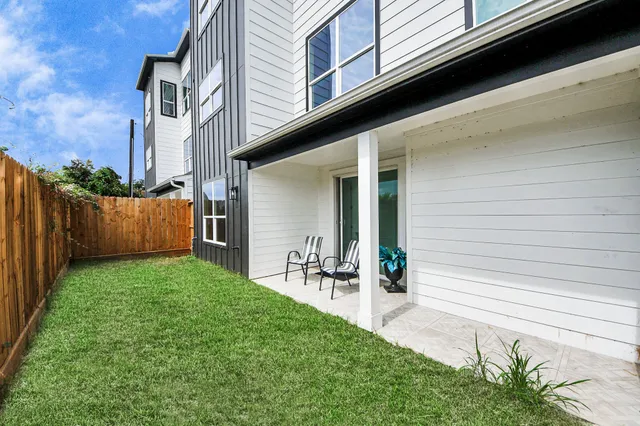a view of backyard with outdoor seating