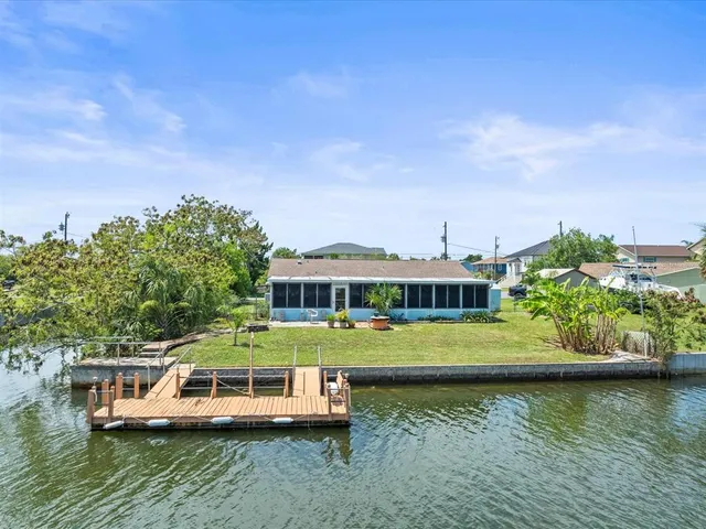 an aerial view of a house with a table lake view