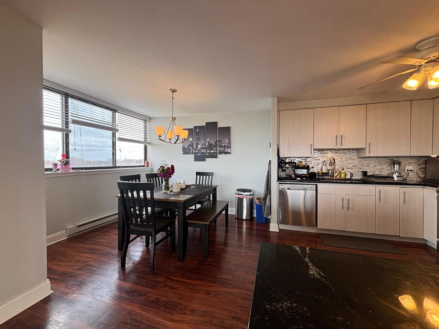 101 Bar Harbour Road, Unit 6M Schaumburg, IL 60193 - Photo 11 of 29 a view of a dining room with furniture and wooden floor