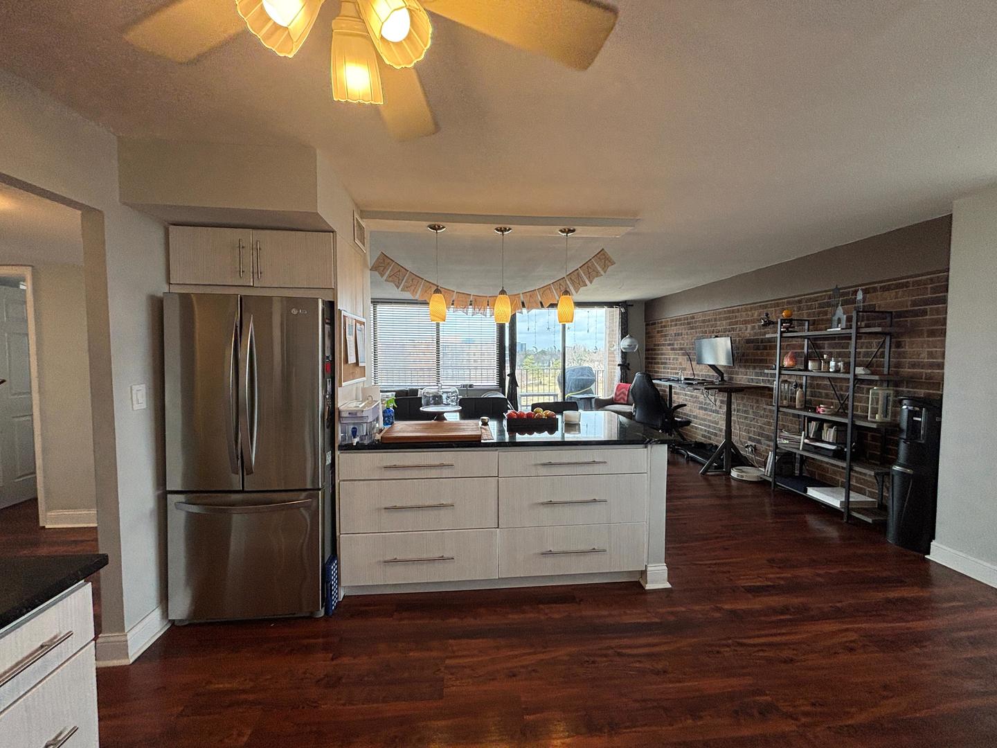 101 Bar Harbour Road, Unit 6M Schaumburg, IL 60193 - Photo 5 of 29 a kitchen with stainless steel appliances granite countertop a refrigerator and a stove