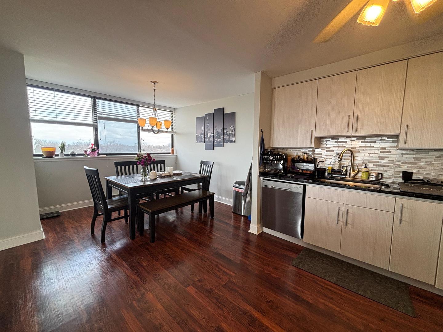 101 Bar Harbour Road, Unit 6M Schaumburg, IL 60193 - Photo 10 of 29 a kitchen with a table chairs stove and cabinets