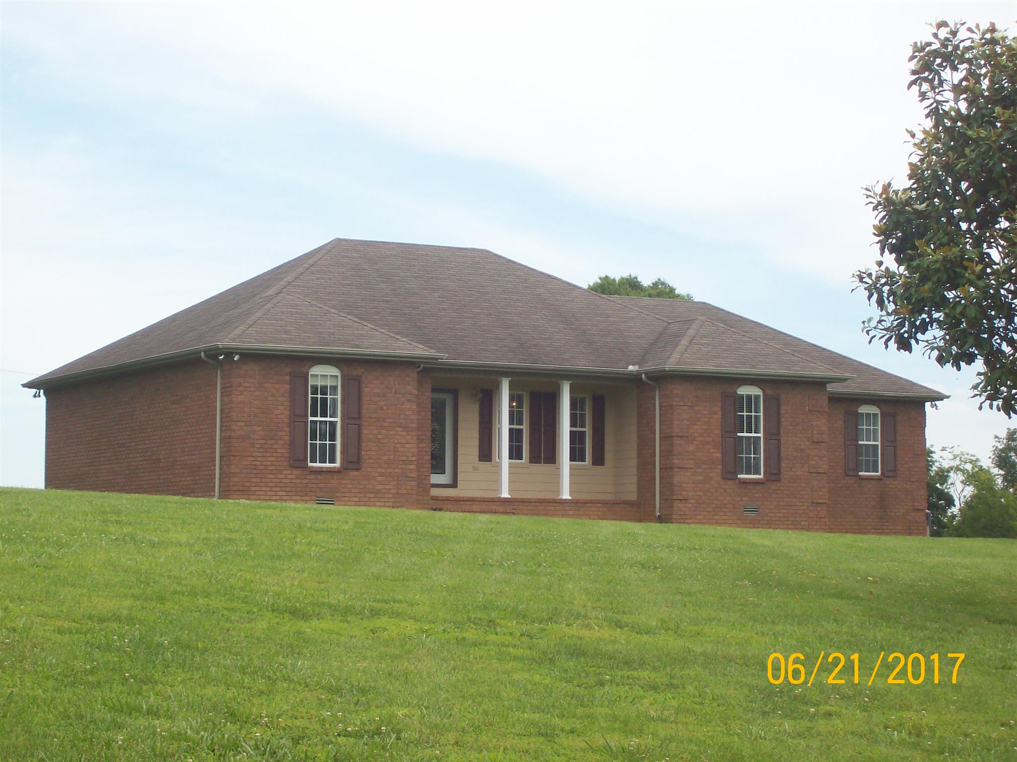 819 Liberty Road Lafayette, TN 37083 - Photo 1 of 13 Beautiful brick home sitting on 8+ acres w/ pond
