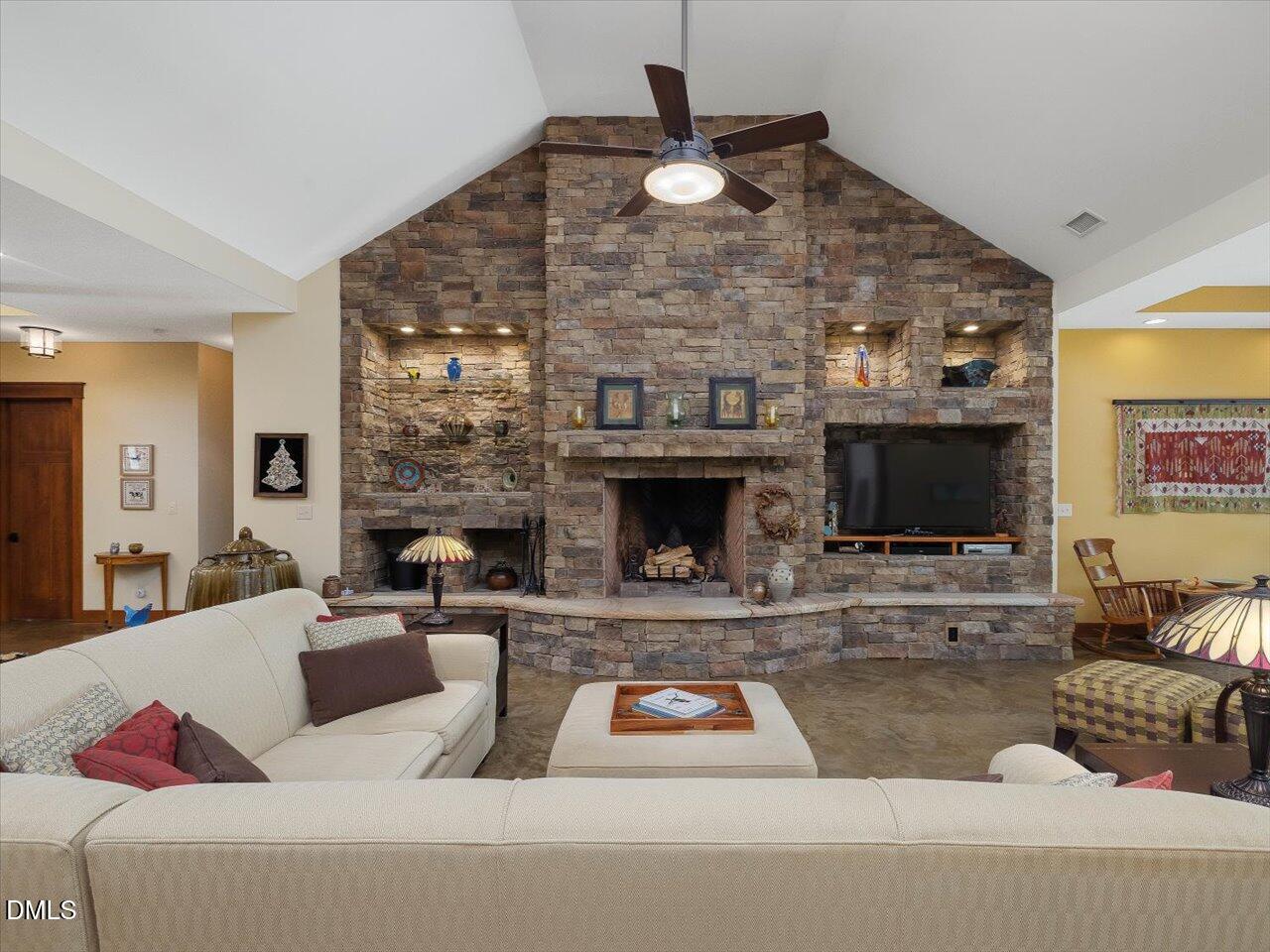 1210 Manco Dairy Road Pittsboro, NC 27312 - Photo 14 of 99 a living room with furniture and a fireplace