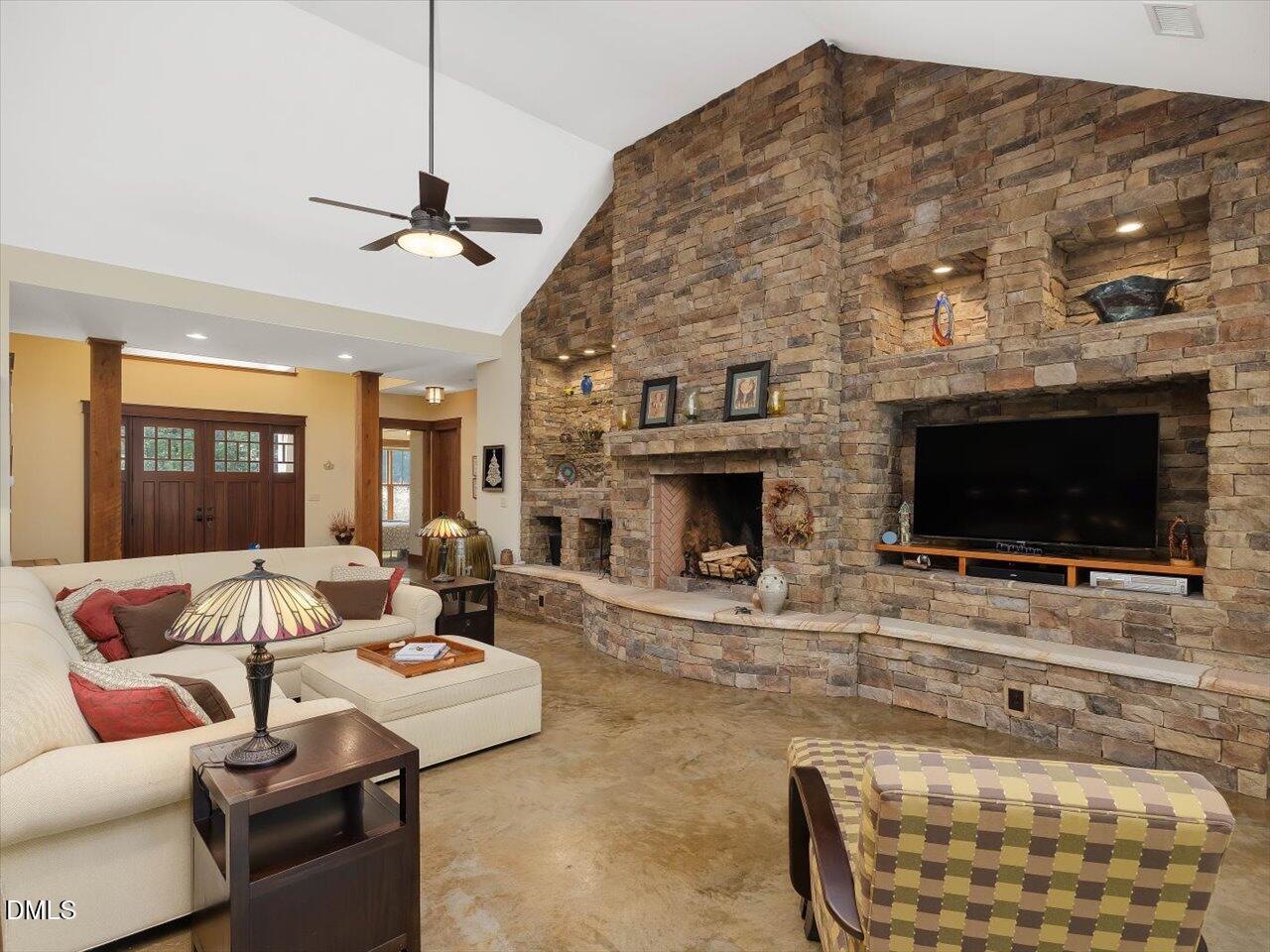 1210 Manco Dairy Road Pittsboro, NC 27312 - Photo 15 of 99 a living room with furniture and a flat screen tv
