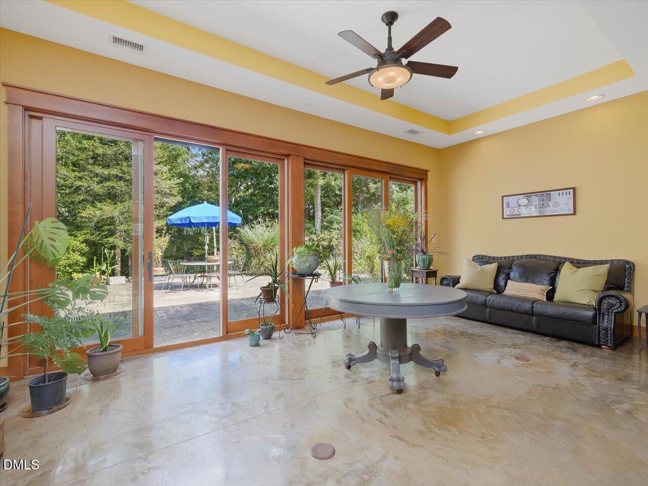 1210 Manco Dairy Road Pittsboro, NC 27312 - Photo 18 of 99 a living room with furniture and a large window