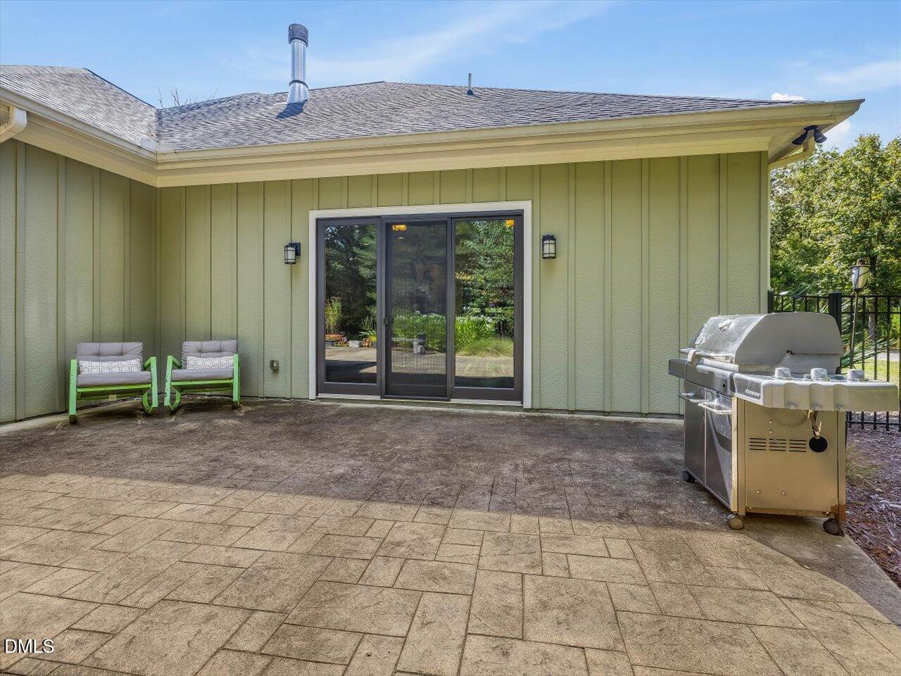 1210 Manco Dairy Road Pittsboro, NC 27312 - Photo 23 of 99 a view of a chair and table in front of a house