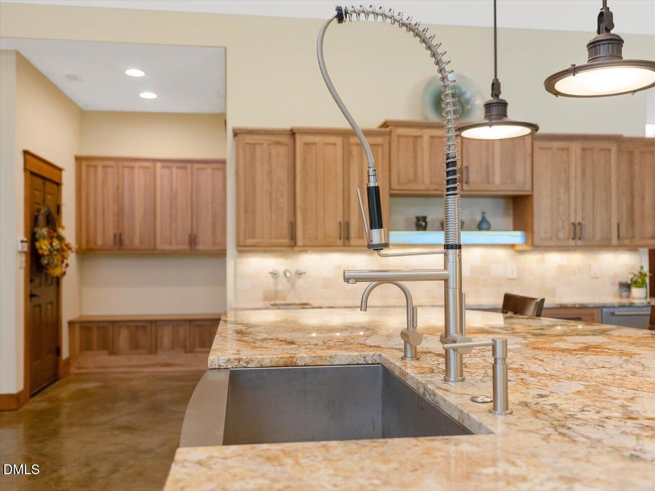 1210 Manco Dairy Road Pittsboro, NC 27312 - Photo 33 of 99 a kitchen with stainless steel appliances granite countertop a sink and a stove