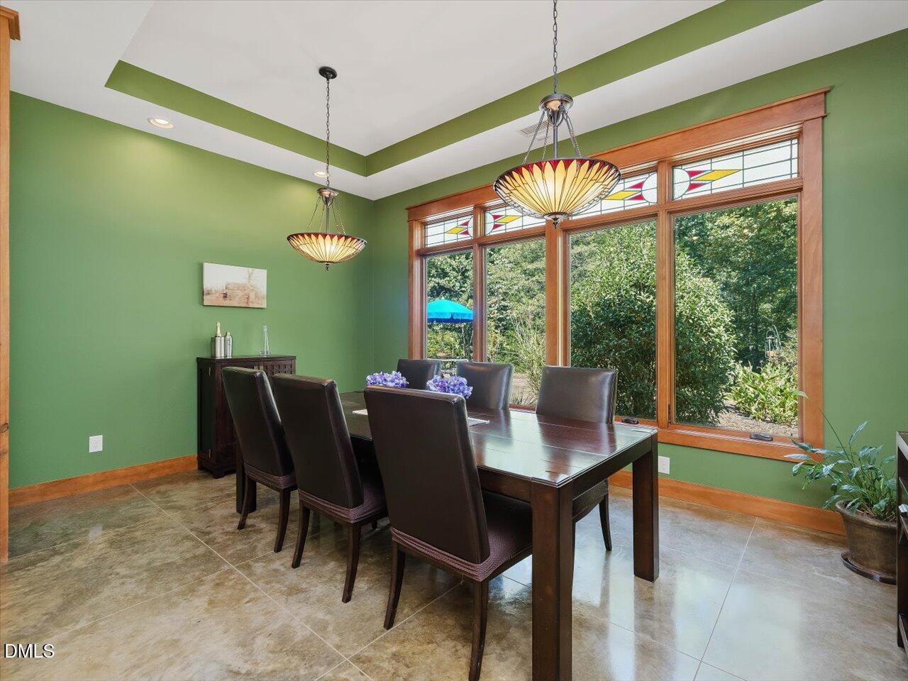 1210 Manco Dairy Road Pittsboro, NC 27312 - Photo 45 of 99 a view of a dining room with furniture window and outside view