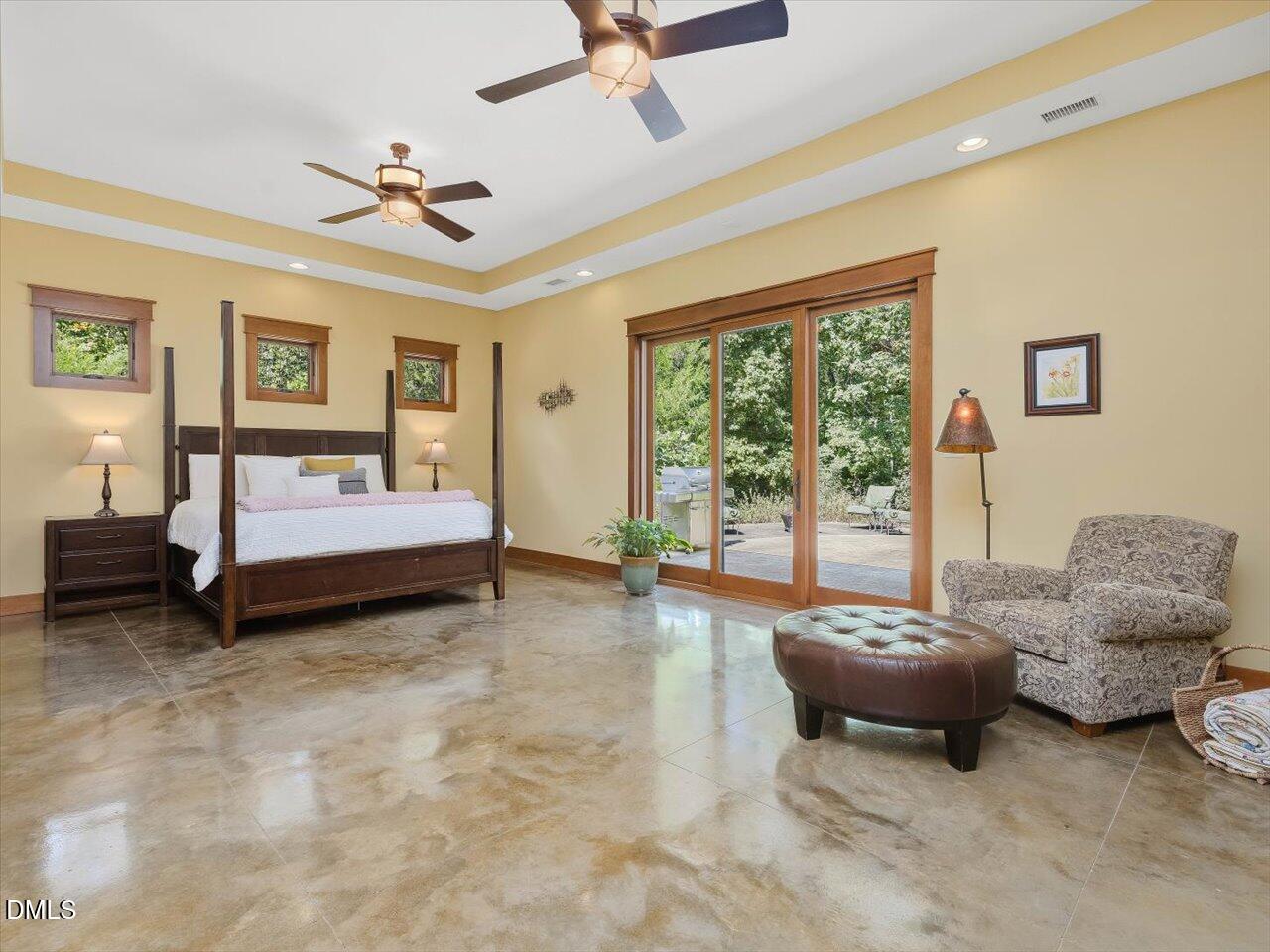 1210 Manco Dairy Road Pittsboro, NC 27312 - Photo 51 of 99 a spacious bedroom with a bed and a couch