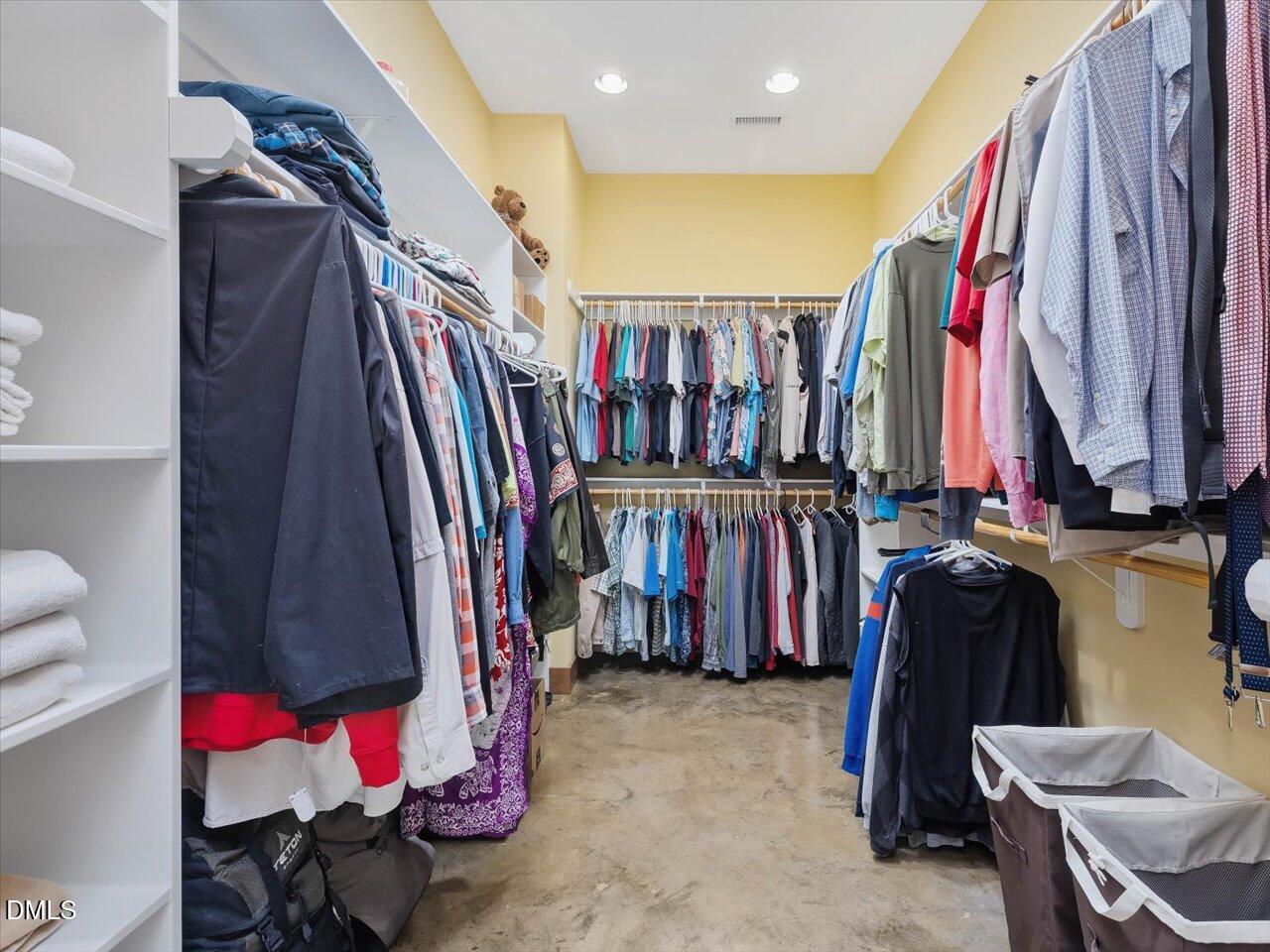 1210 Manco Dairy Road Pittsboro, NC 27312 - Photo 56 of 99 a view of walk in closet with clothes and shoes