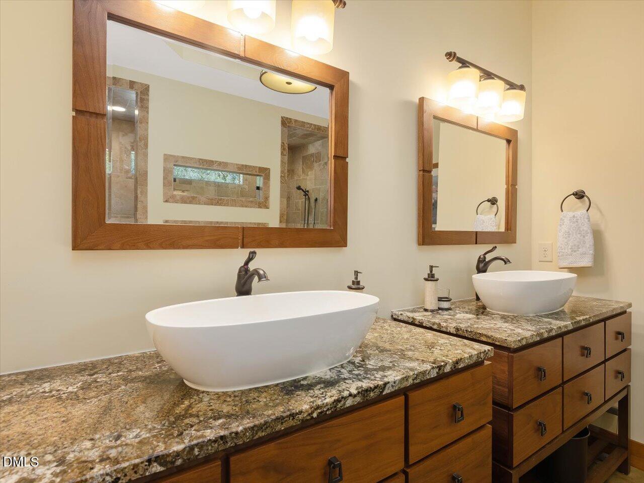 1210 Manco Dairy Road Pittsboro, NC 27312 - Photo 58 of 99 a bathroom with a granite countertop sink and a mirror