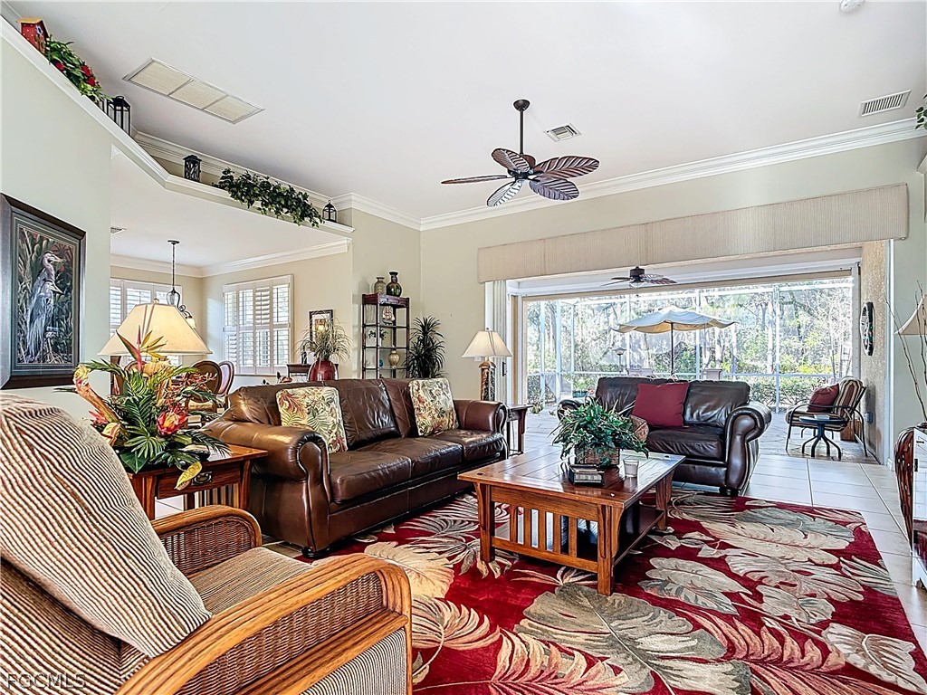 20763 Athenian Lane North Fort Myers, FL 33917 - Photo 15 of 49 a living room with furniture and a large window