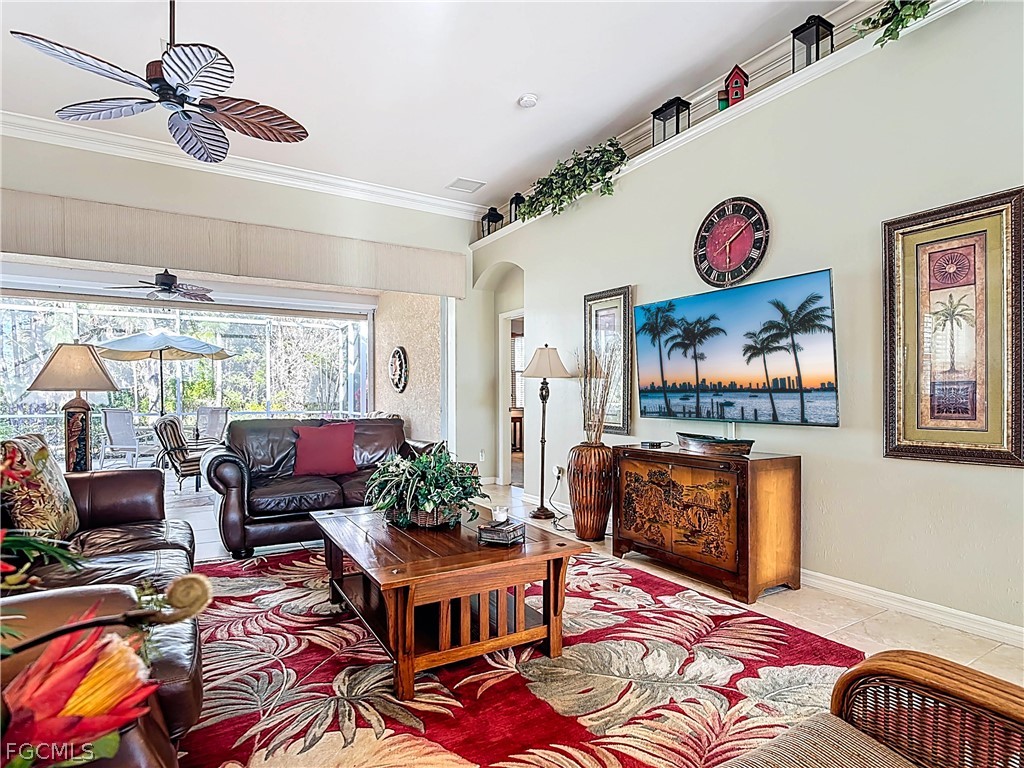 20763 Athenian Lane North Fort Myers, FL 33917 - Photo 16 of 49 a living room with furniture and a flat screen tv