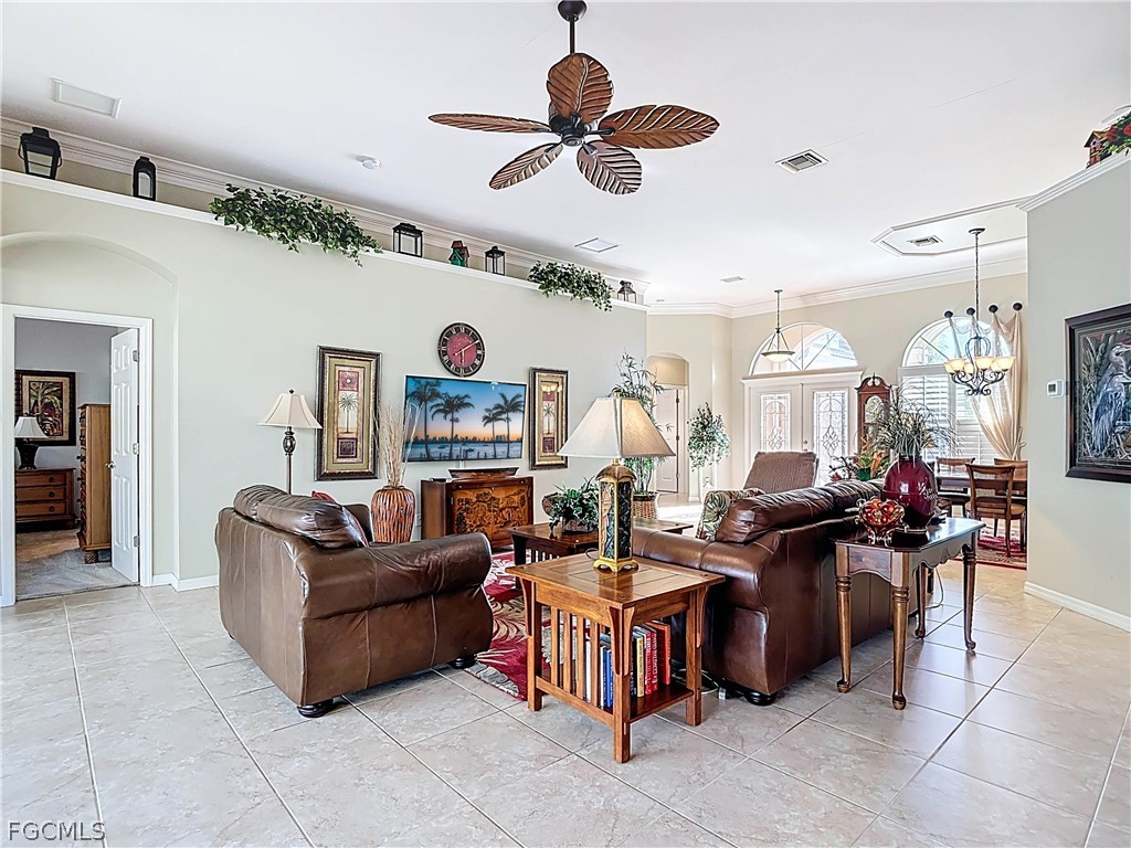 20763 Athenian Lane North Fort Myers, FL 33917 - Photo 17 of 49 a living room with lots of furniture and a chandelier