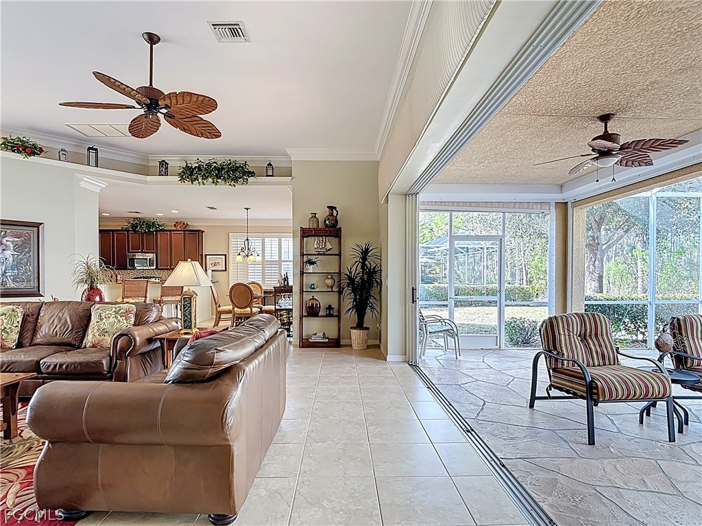 20763 Athenian Lane North Fort Myers, FL 33917 - Photo 19 of 49 a living room with furniture a flat screen tv and a large window