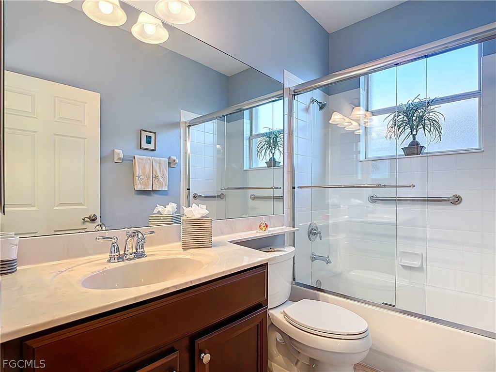 20763 Athenian Lane North Fort Myers, FL 33917 - Photo 24 of 49 a bathroom with a sink a toilet and shower