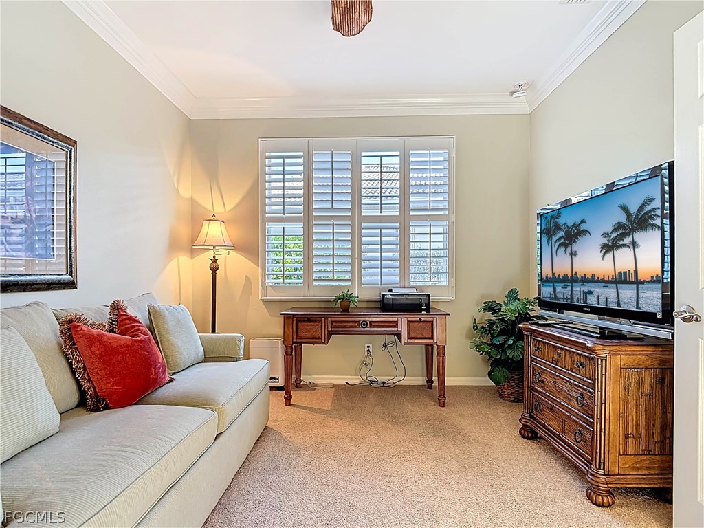 20763 Athenian Lane North Fort Myers, FL 33917 - Photo 25 of 49 a living room with furniture and a flat screen tv