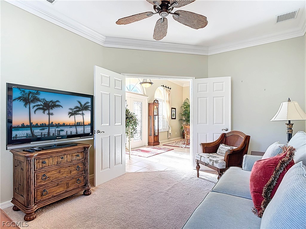 20763 Athenian Lane North Fort Myers, FL 33917 - Photo 27 of 49 a living room with furniture and a flat screen tv