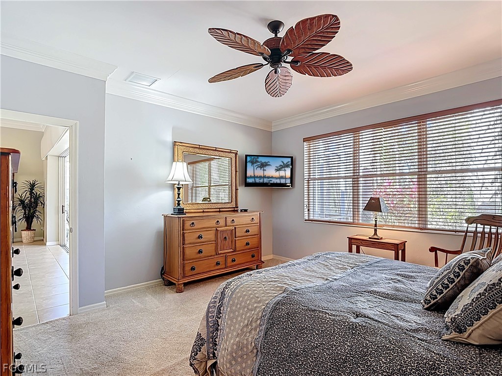 20763 Athenian Lane North Fort Myers, FL 33917 - Photo 29 of 49 a bedroom with a bed and a dresser