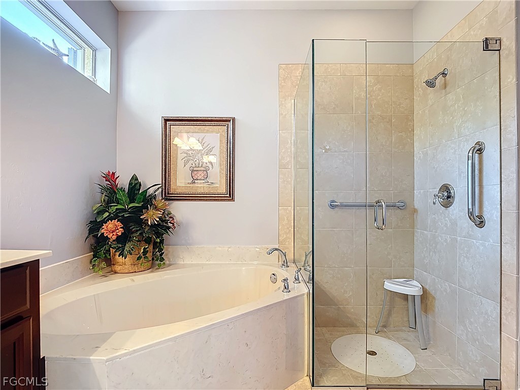 20763 Athenian Lane North Fort Myers, FL 33917 - Photo 33 of 49 a white bath tub sitting next to a white toilet
