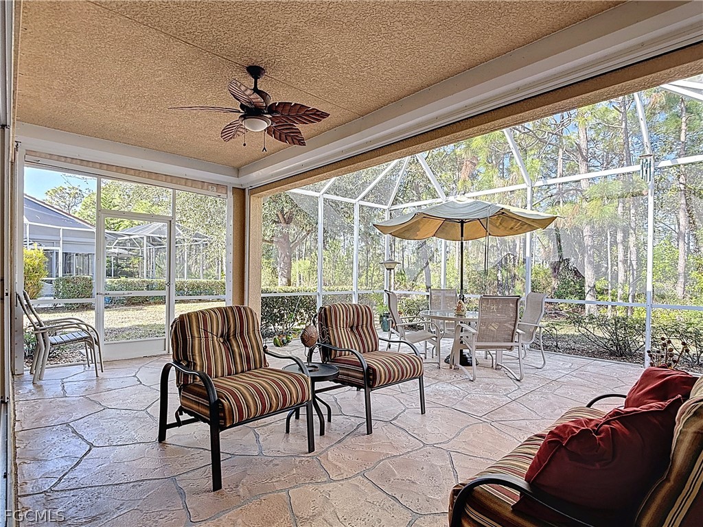 20763 Athenian Lane North Fort Myers, FL 33917 - Photo 36 of 49 a living room with furniture and a large window