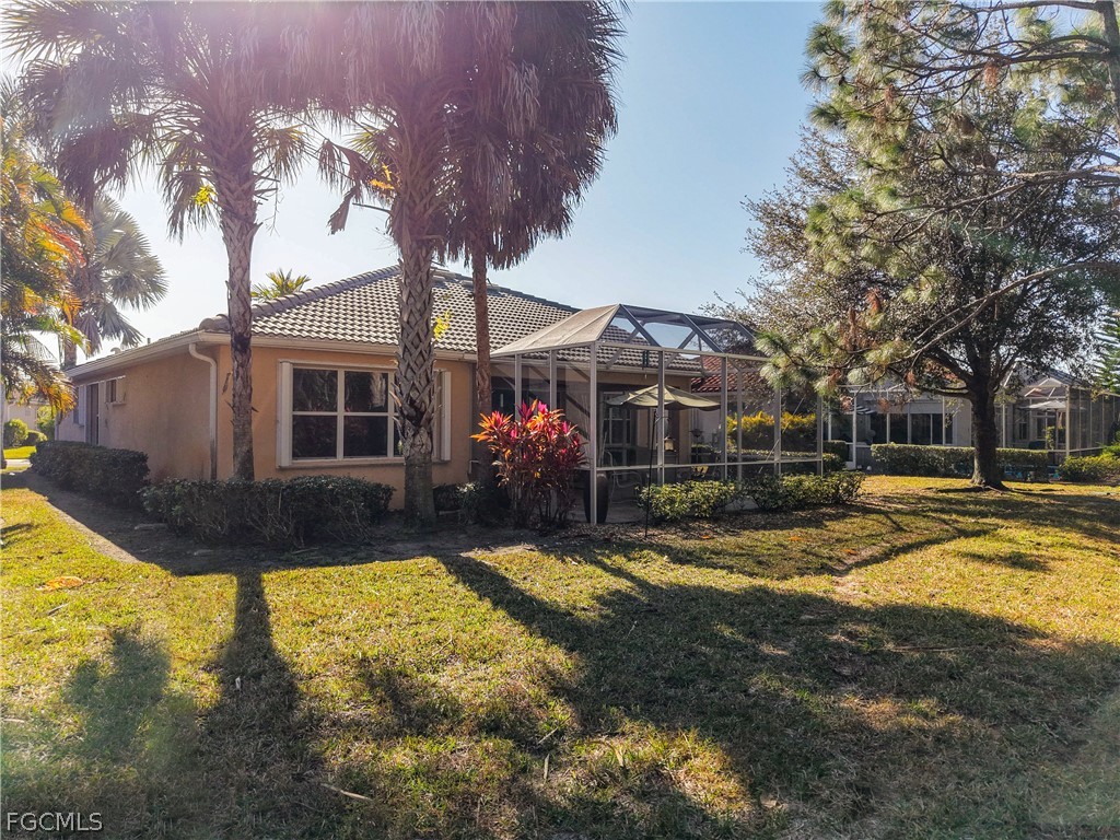 20763 Athenian Lane North Fort Myers, FL 33917 - Photo 42 of 49 a view of a house with swimming pool and sitting area