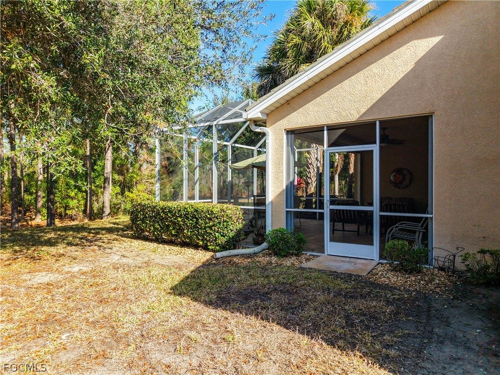 20763 Athenian Lane North Fort Myers, FL 33917 - Photo 43 of 49 a view of a house with a yard and plants