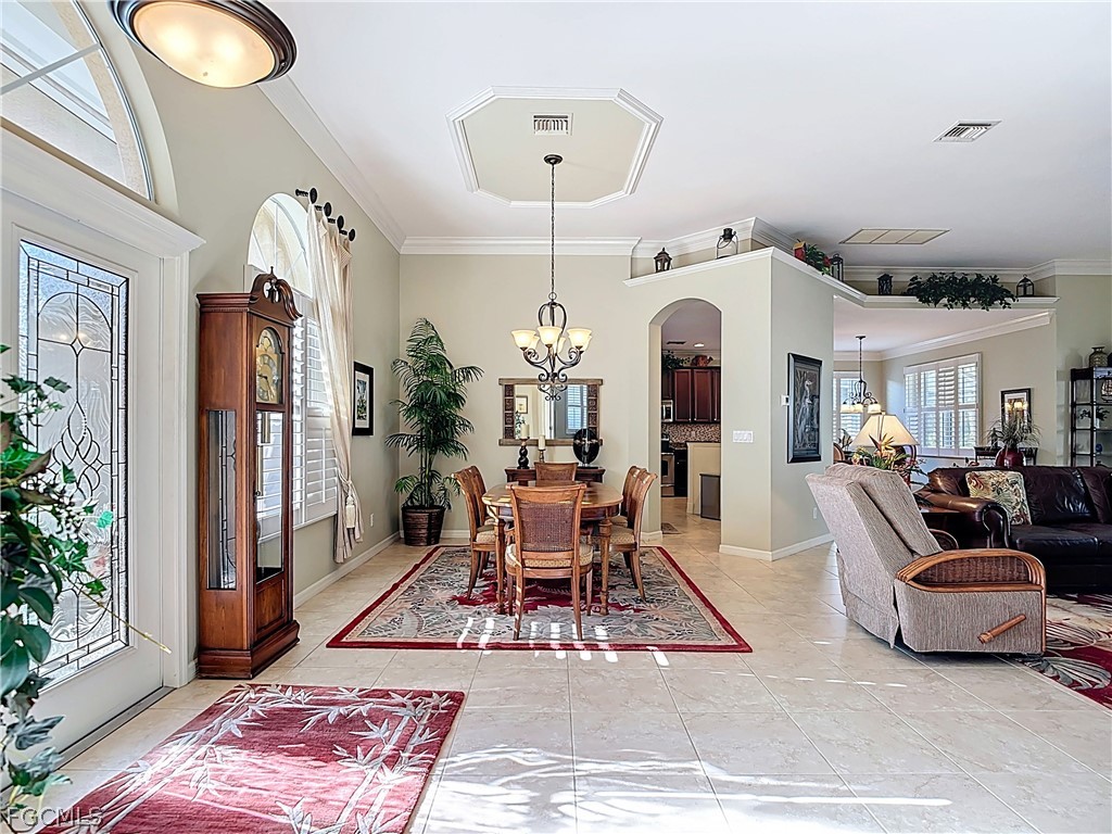20763 Athenian Lane North Fort Myers, FL 33917 - Photo 6 of 49 a living room with furniture and a chandelier